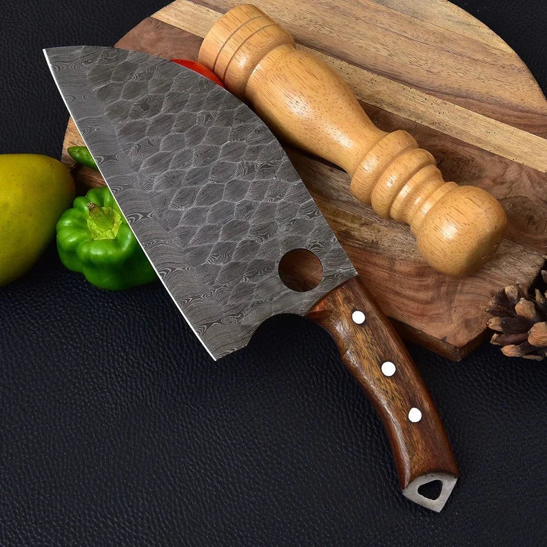 Damascus steel cleaver with wide patterned blade and wooden handle