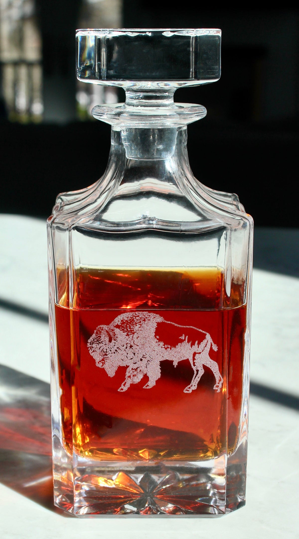 Square crystal whiskey decanter engraved with a bison