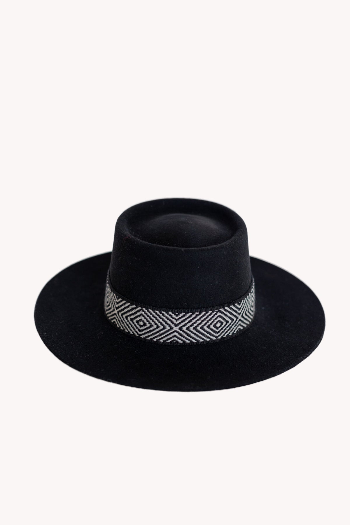Black alpaca wool felt bucket hat with a woven textile band