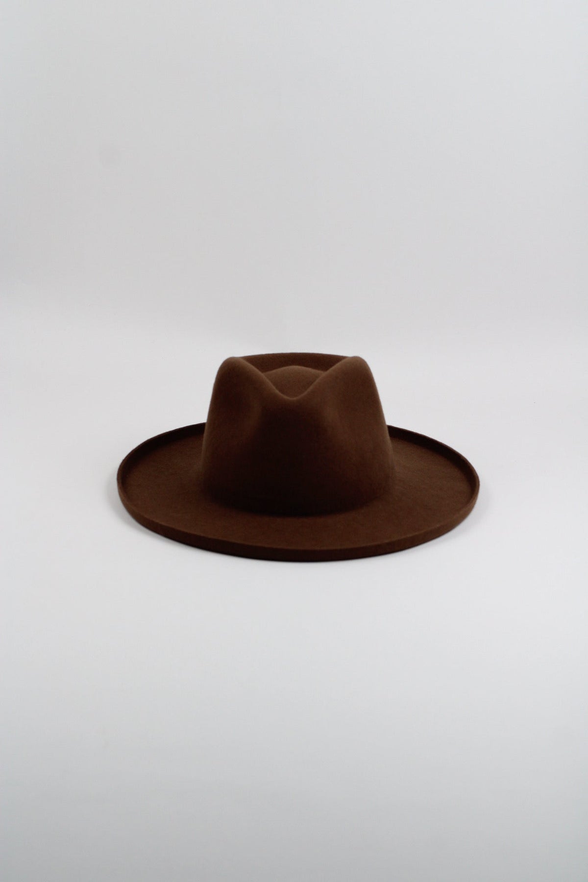 Caramel wool felt hat with a teardrop crown and pencil-rolled brim