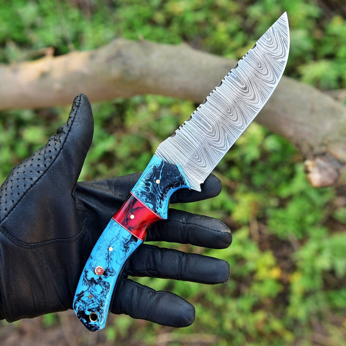 Long Damascus hunting knife with a resin handle and handcrafted leather sheath