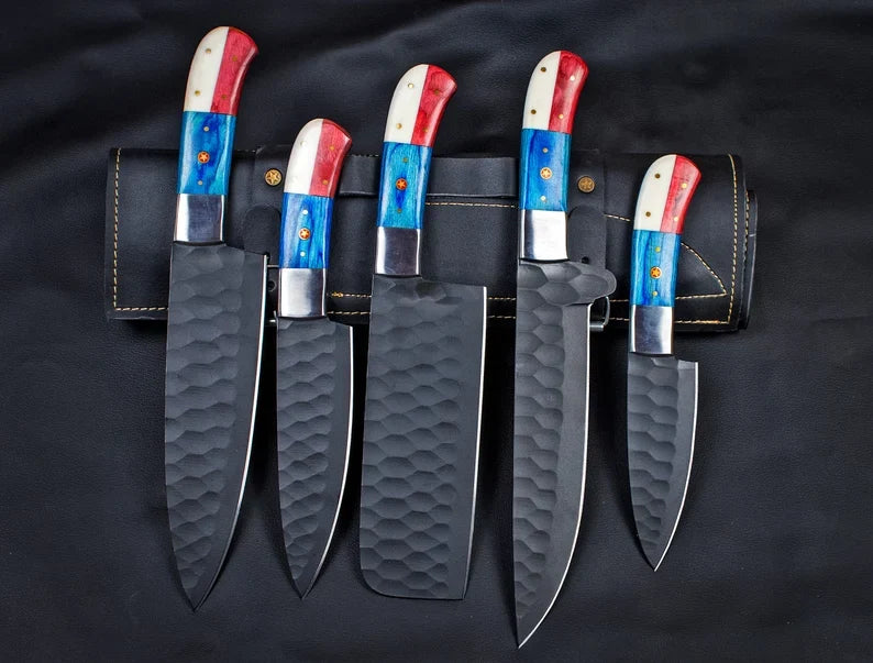 Five carbon steel chef knives with Texas flag handles and leather sheath