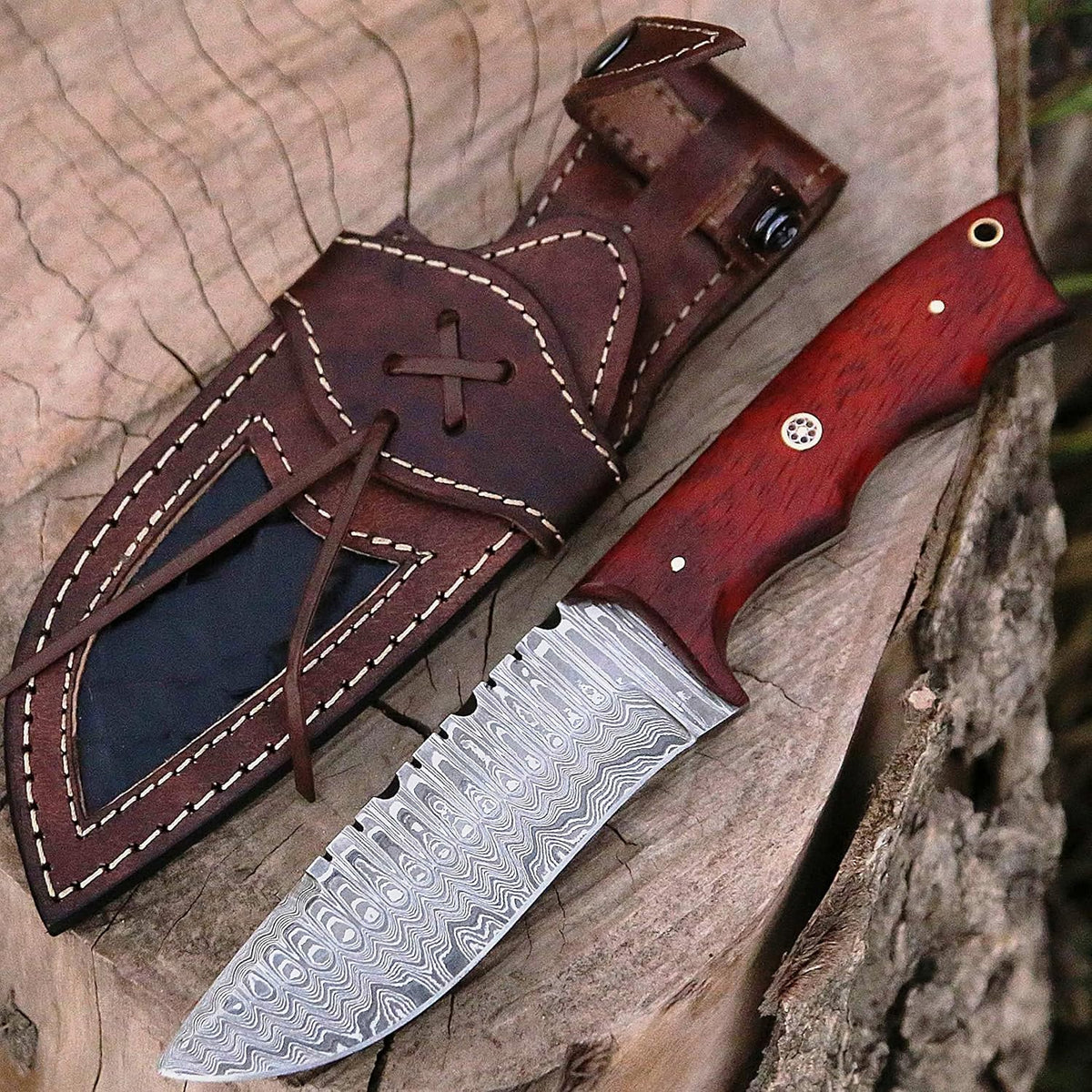 Damascus skinner knife with a reddish-orange Padauk wood handle