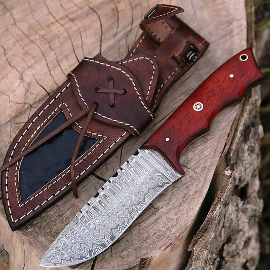 Damascus skinner knife with a reddish-orange Padauk wood handle