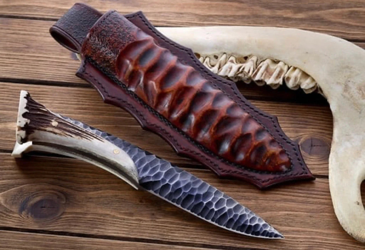 1095 steel hunting knife with antler horn handle and leather sheath