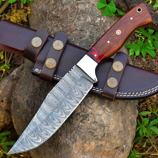 Damascus skinning knife with rosewood and resin handle and steel bolster