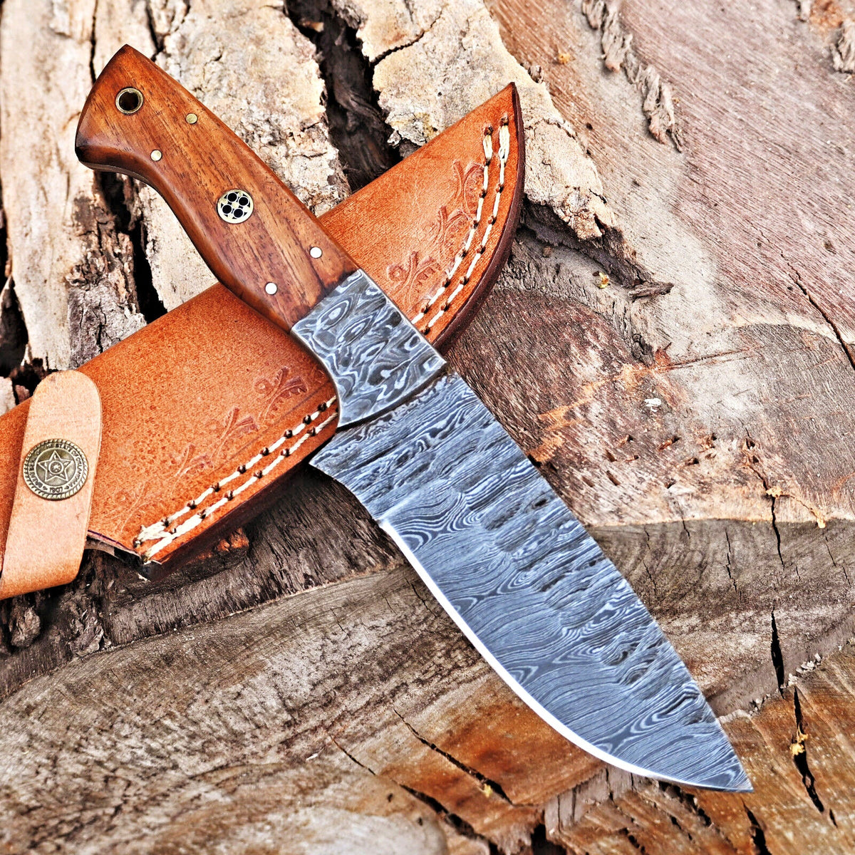 Damascus skinning knife with rosewood handle and Damascus bolster
