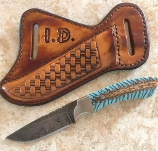 Damascus belt knife with pine cone resin handle, steel bolster and leather sheath