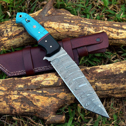 Damascus skinning knife with an ergonomic resin handle