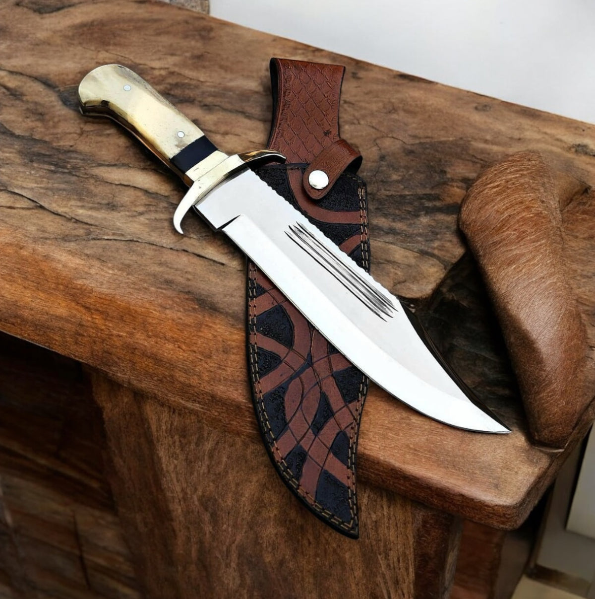 J2 steel Bowie knife with camel bone handle, brass guard, and leather sheath