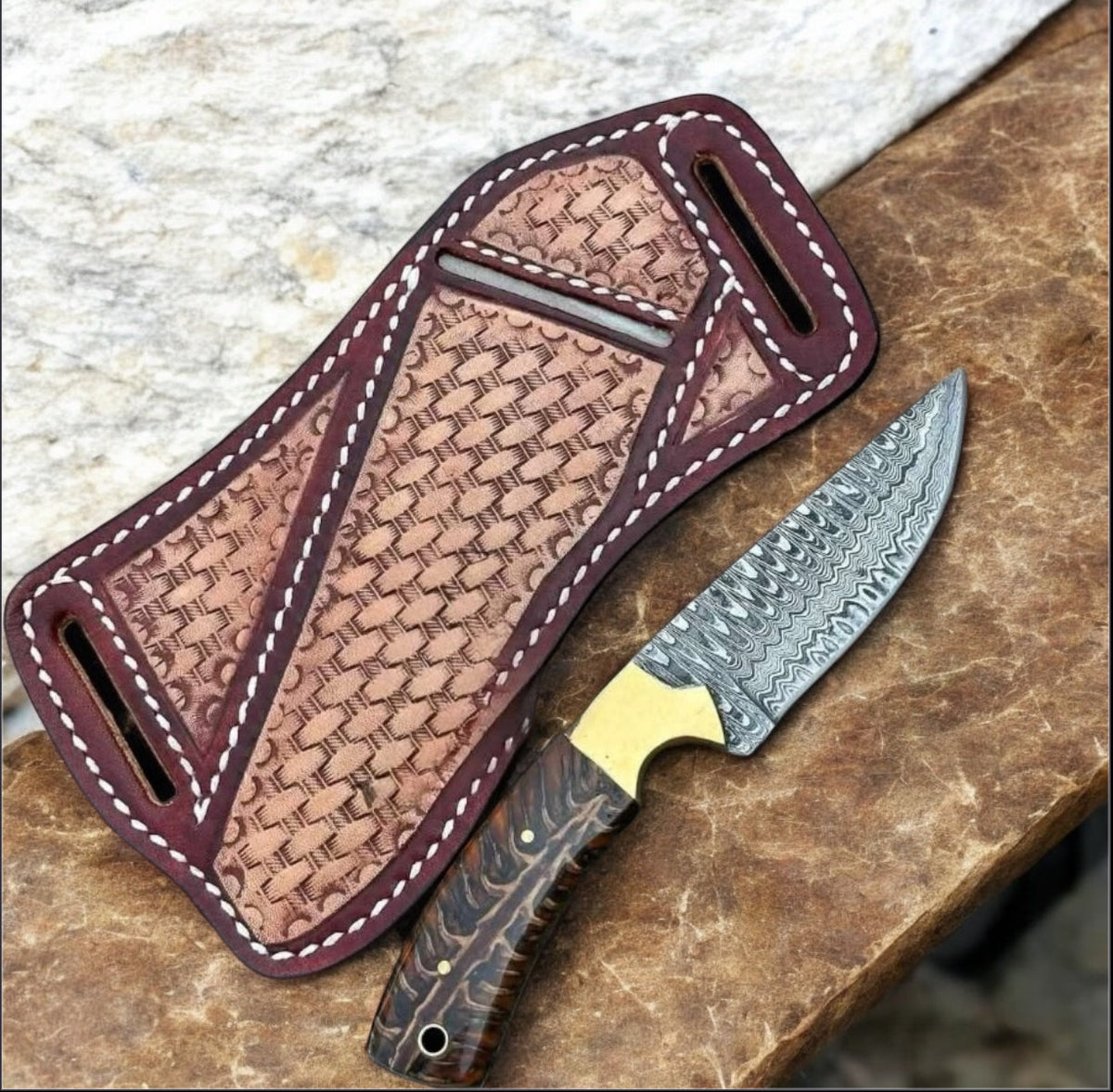 Damascus belt knife with pine cone handle, brass bolster, and leather sheath