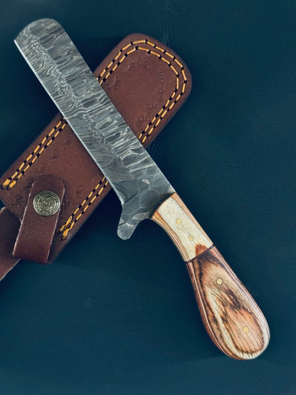 Damascus bull cutter knife with a pakkawood handle and leather sheath