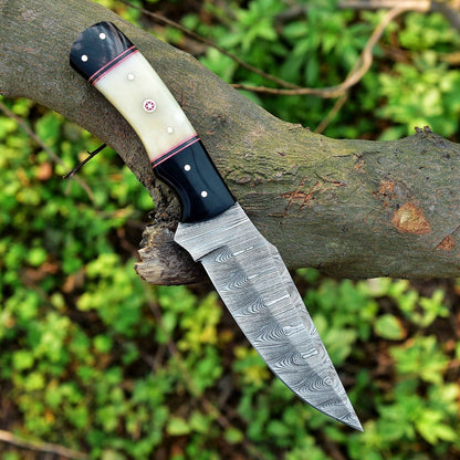 Set of Damascus skinning knives with camel bone and resin handles