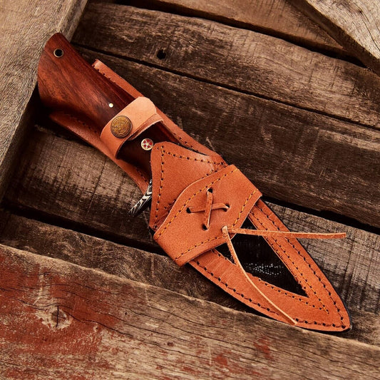 Small Damascus hunting knife with rosewood handle, Damascus guard, and leather sheath