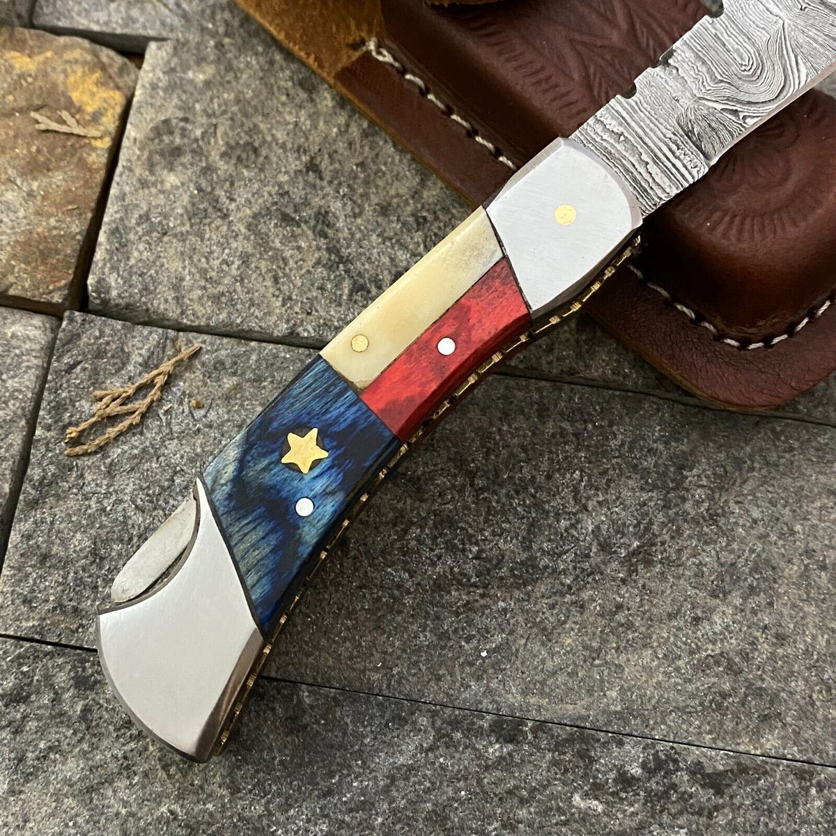 Damascus pocket knife with Texas flag handle and leather sheath