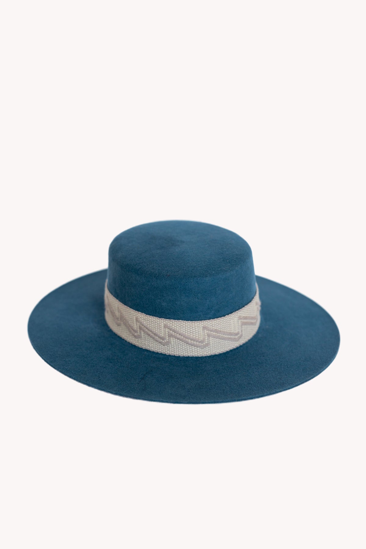 Denim blue alpaca wool felt Spanish style hat with a woven band