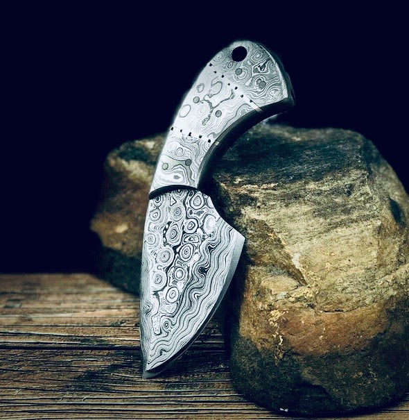 Small all-Damascus steel fixed blade skinner with leather sheath