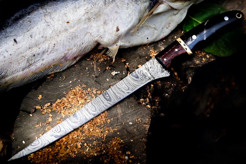 Damascus fillet knife with buffalo horn and rosewood handle, brass spacers and leather sheath