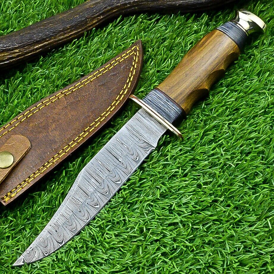 Damascus Western camp knife with an olive wood handle and metal guard