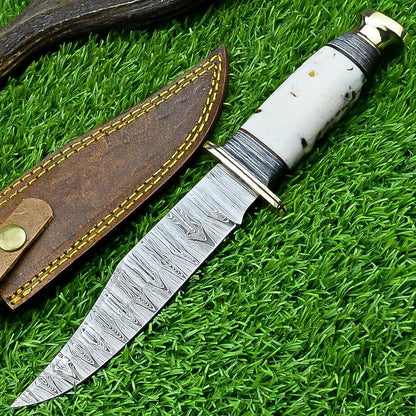 Damascus Western camp knife with an epoxy resin handle and solid brass guard