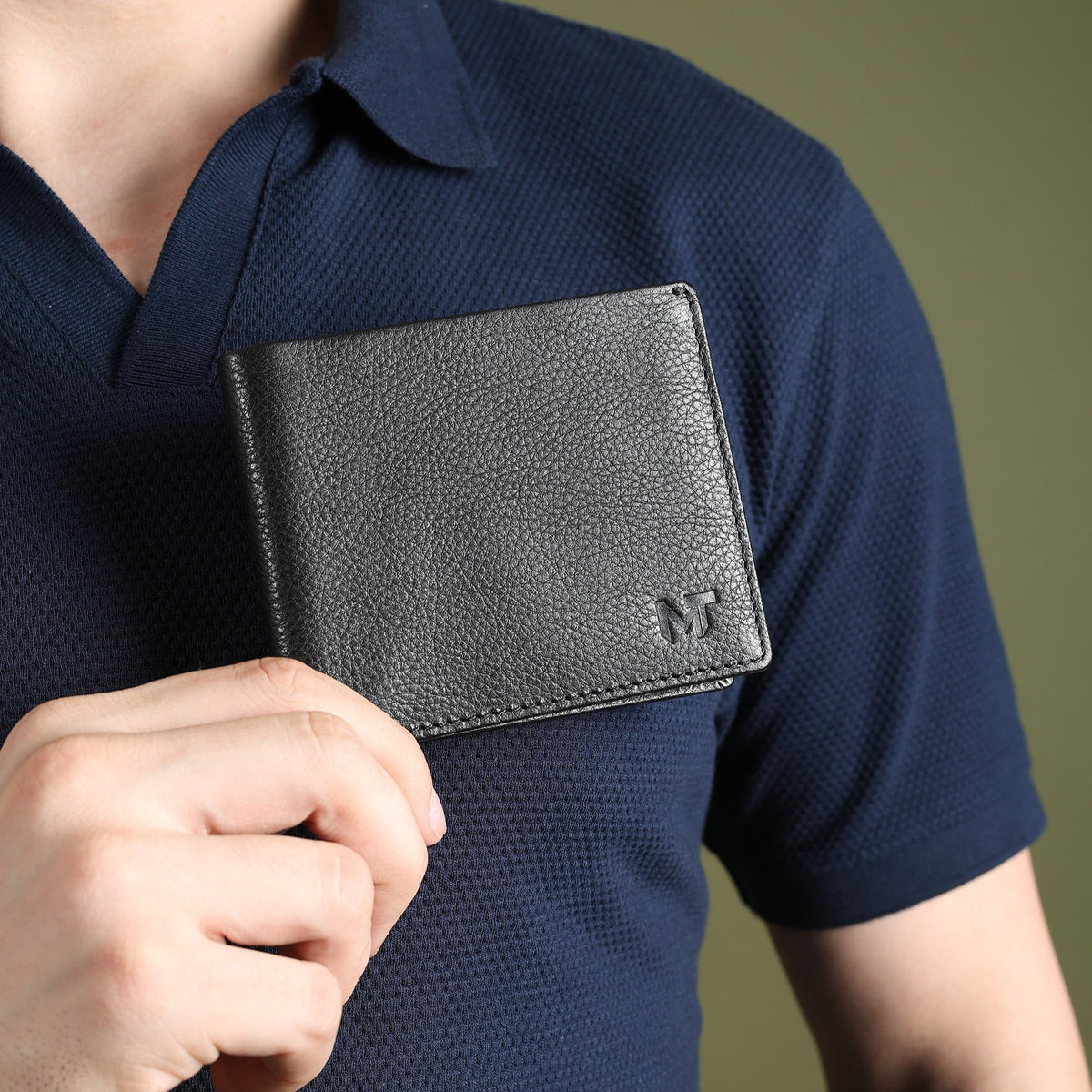 Black leather card wallet open to show yellow leather interior