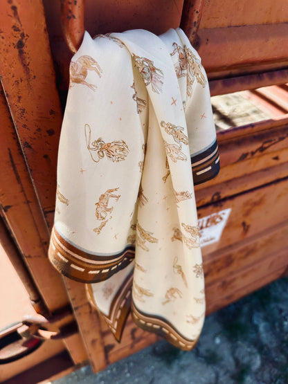 Neutral-tone wild rag printed with cowgirls riding and walking their horses, view 3