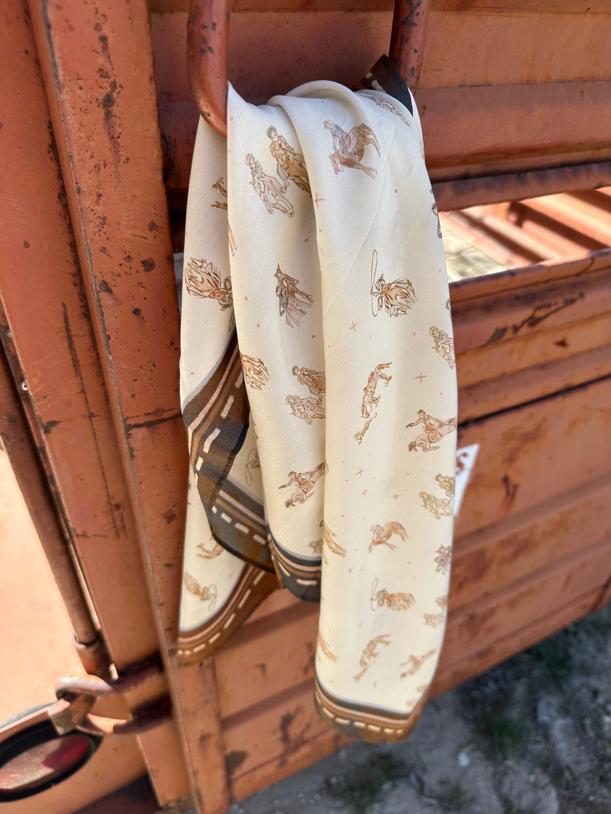 Neutral-tone wild rag printed with cowgirls riding and walking their horses, view 4