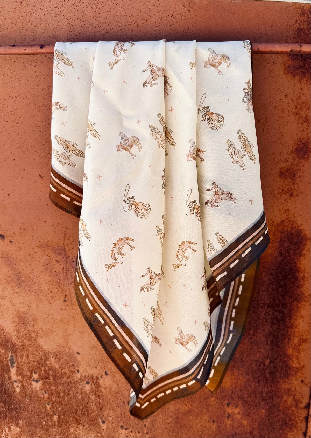 Neutral-tone wild rag printed with cowgirls riding and walking their horses, view 2