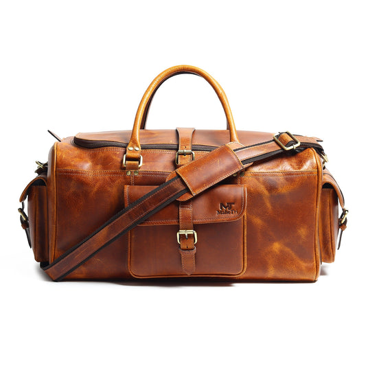 Full-grain leather weekender duffle with brass hardware and shoulder strap