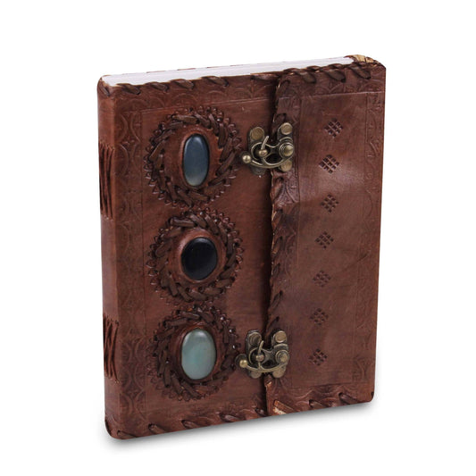 Vintage leather journal with three embossed stones on the cover