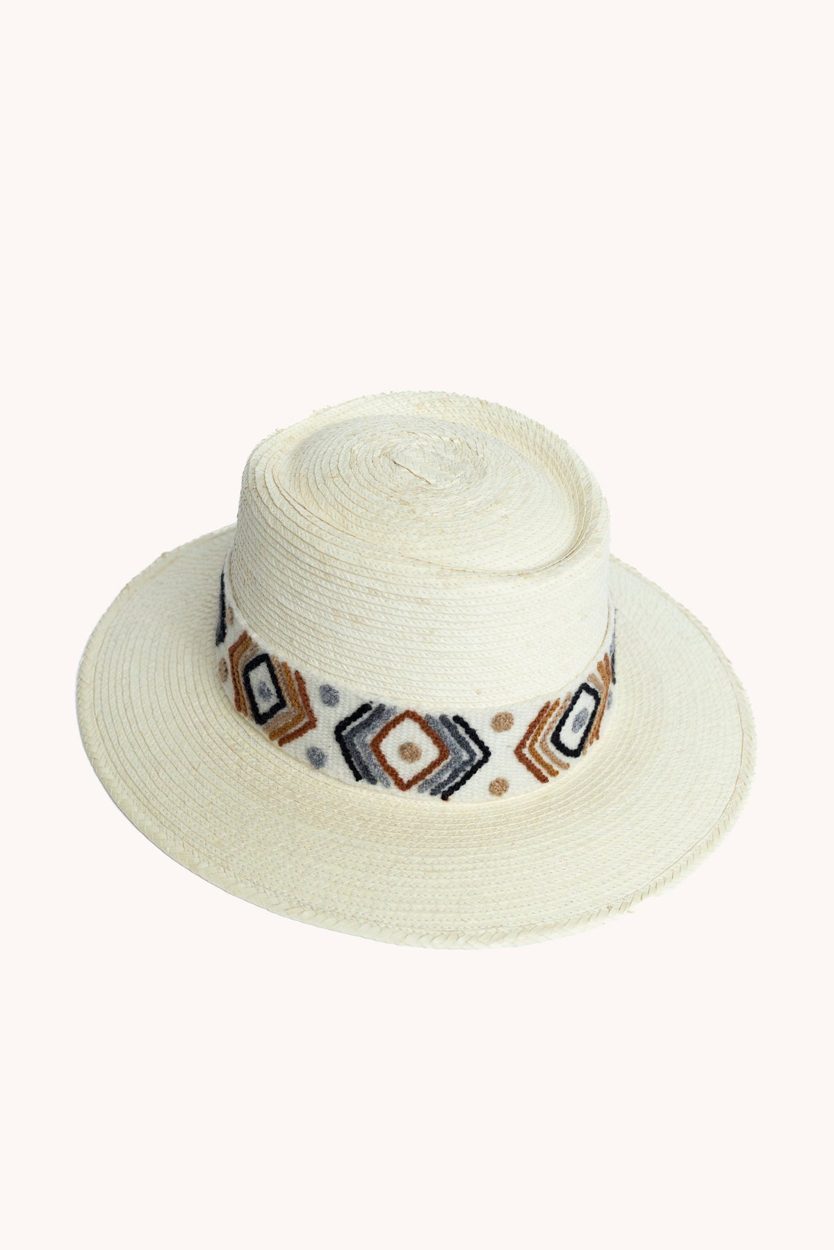 White palm leaf straw bucket hat with a woven textile band