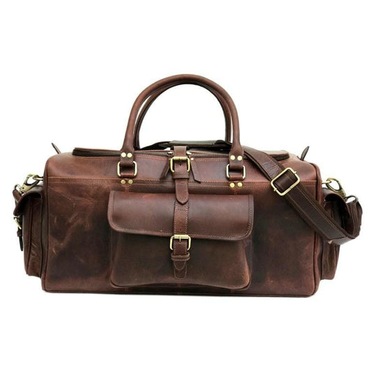 Dark brown leather duffle bag with shoulder strap and buckled pockets