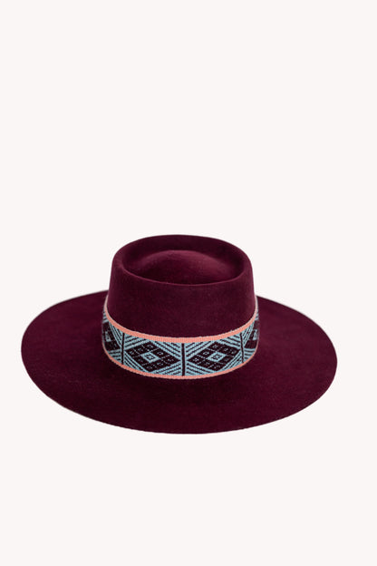 Maroon alpaca wool felt bucket hat with a woven textile band