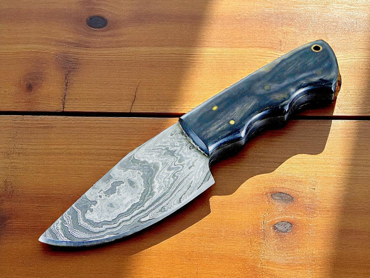 Compact Damascus skinning knife with pakkawood handle