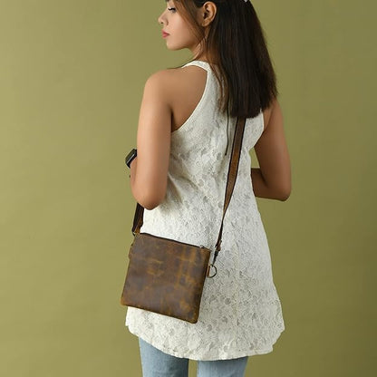 Buffalo leather crossbody sling bag with brass hardware and adjustable strap, view 2