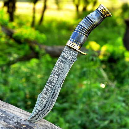 Damascus steel bowie knife with brass guard, colored camel bone handle and leather sheath