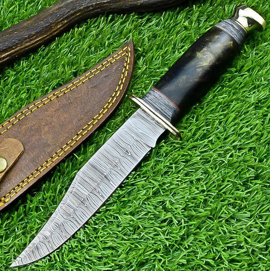 Damascus Western camp knife with an epoxy resin handle and polished brass guard