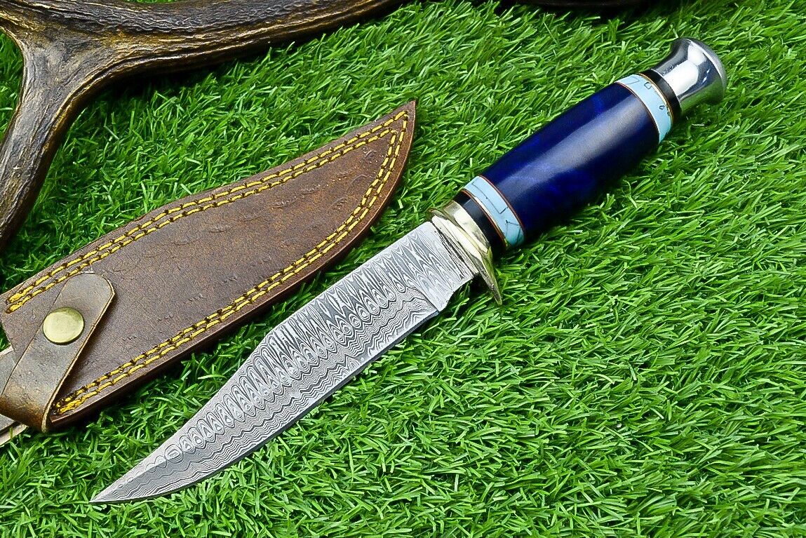 Damascus Western camp knife with a colorful epoxy resin handle and metal guard