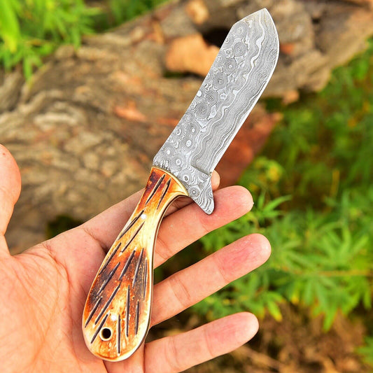 Short Damascus ranch knife with a camel bone handle and leather sheath