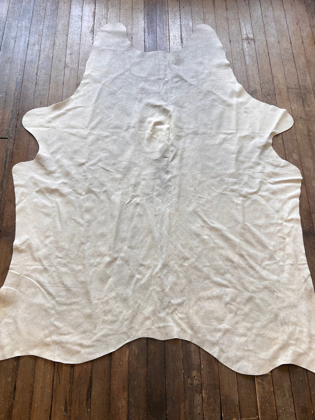 Brazilian cowhide rug about 7 by 5 feet