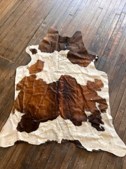 Genuine Brazilian cowhide rug laid flat, 6.5 by 4.5 feet