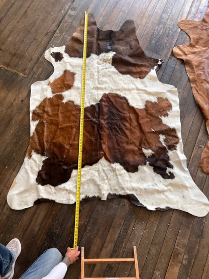 The Brazilian Cowhide Rug, 6.5 × 4.5 ft | Cowhide and Conchos