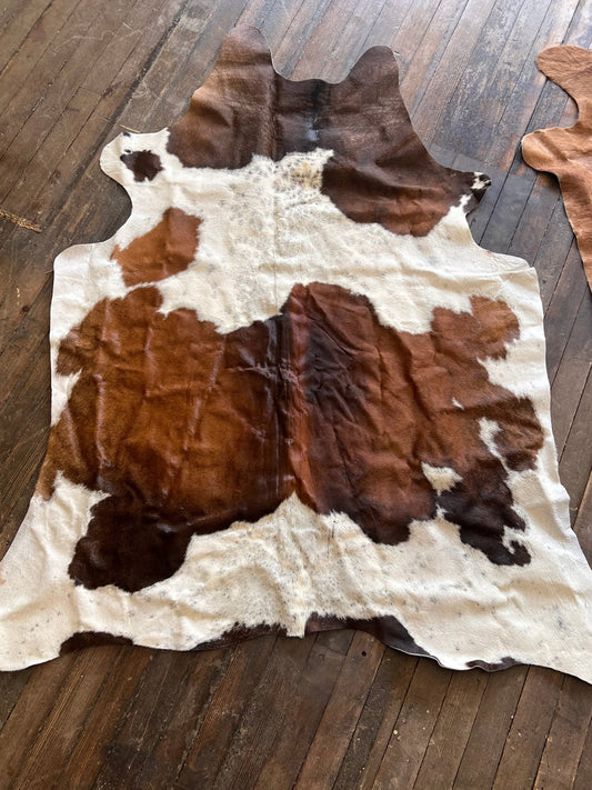 The Brazilian Cowhide Rug, 6.5 × 4.5 ft | Cowhide and Conchos