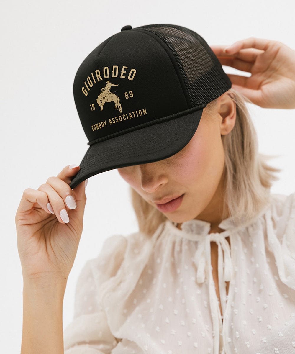 Black foam and mesh trucker hat with a hand-drawn cowboy and bucking bronco, view 3