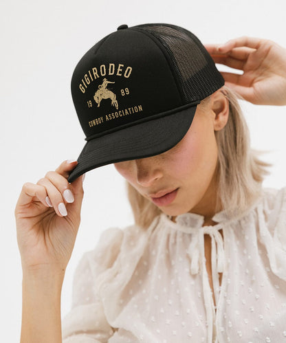 Black foam and mesh trucker hat with a hand-drawn cowboy and bucking bronco, view 3