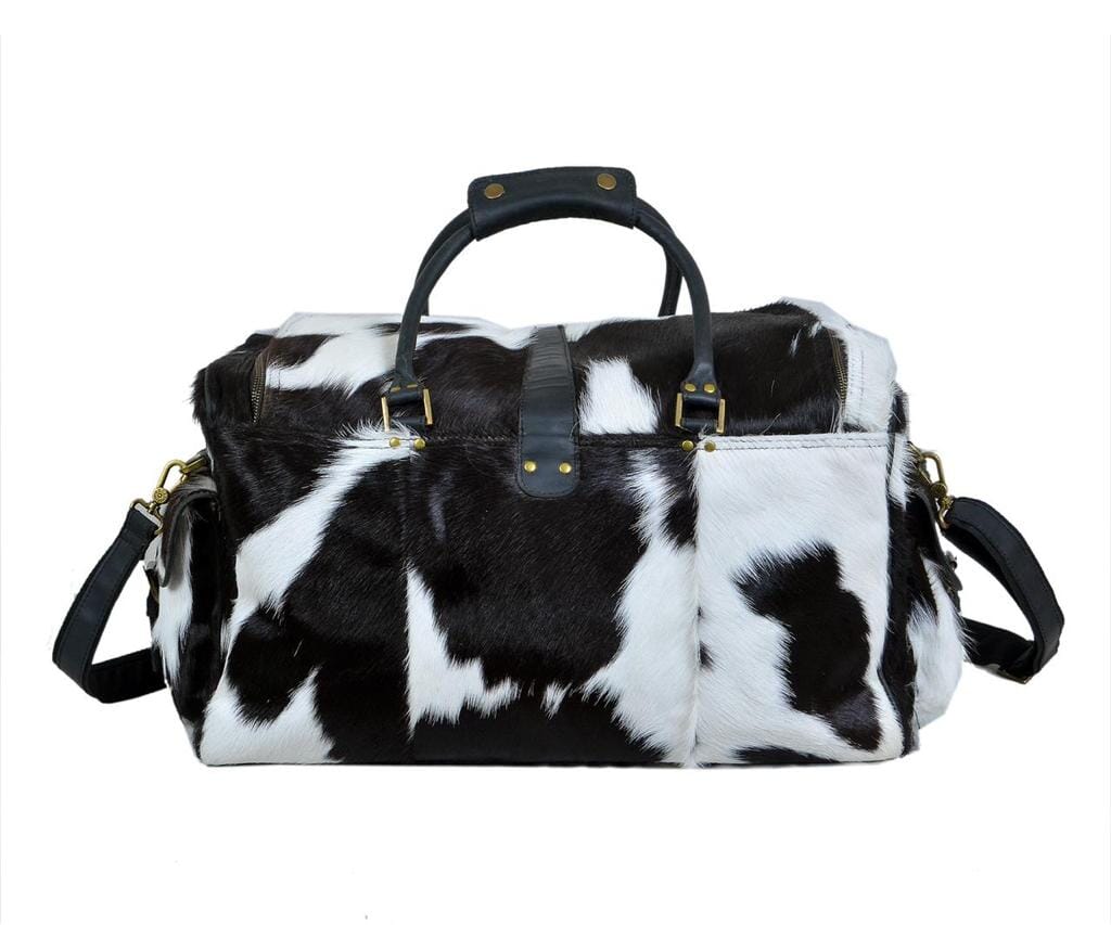 Black and white hair-on cowhide duffel bag with shoulder strap